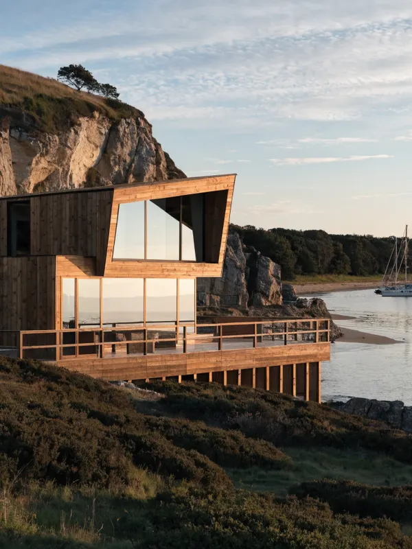 Timber-clad holiday home overlooking a harbour of yachts